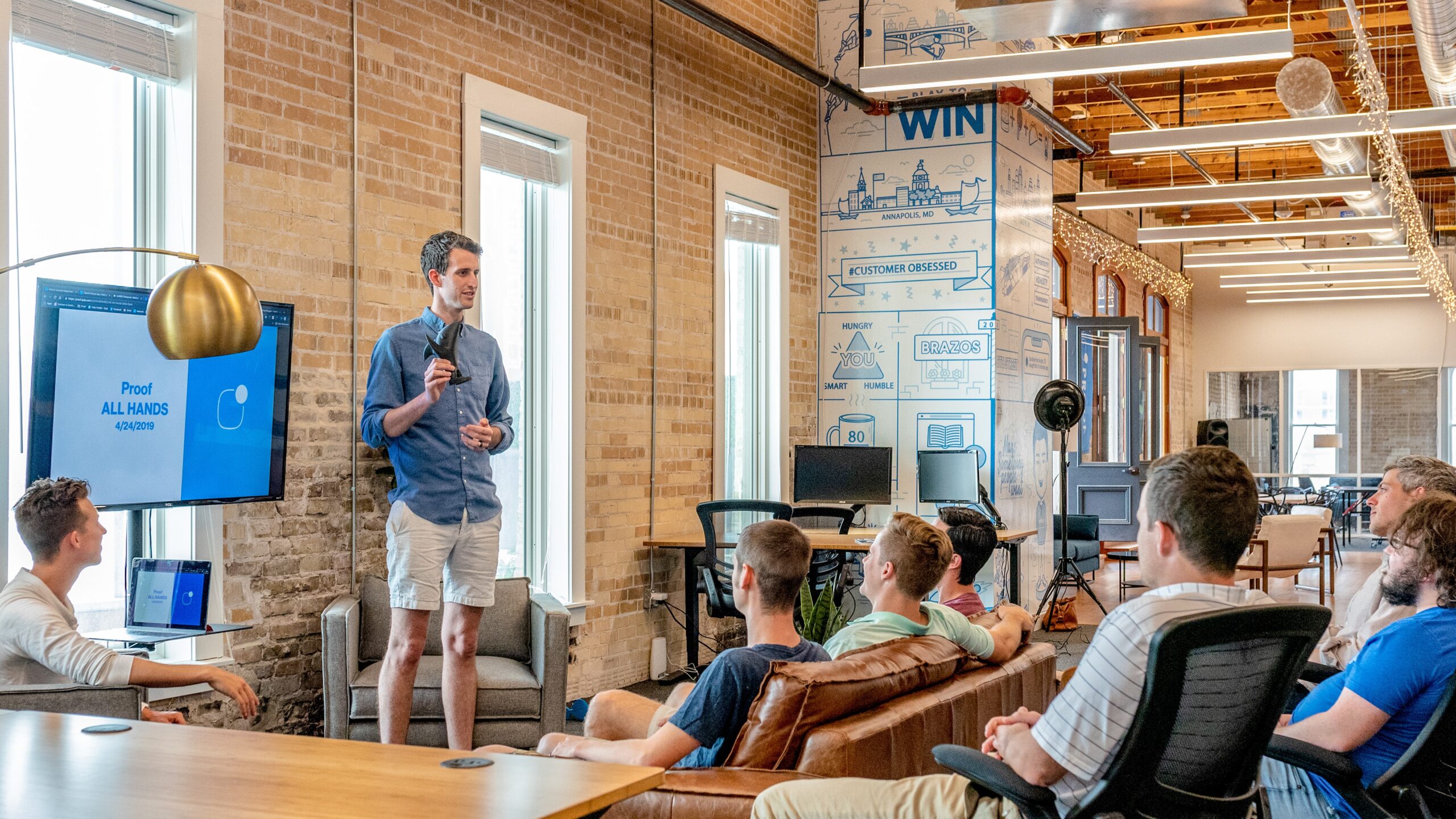 A man presents his project to the work team